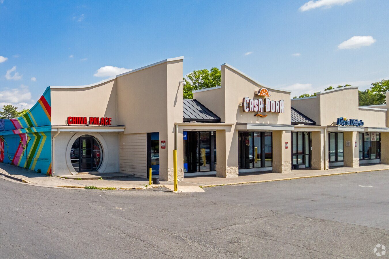 Business plaza storefronts in Langley Park, Maryland